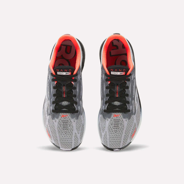 A pair of Reebok Nano Pro Training Shoes in gray and black with red inner linings and NANO branding on the insoles, shown from above against a white background—ideal for athletes aiming for peak performance.