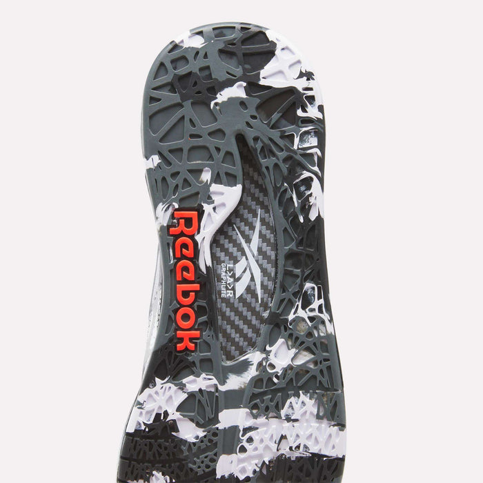 Close-up of the Reebok Nano Pro Training Shoes sole featuring a black and white abstract pattern, geometric texture, SuperFloat foam cushioning, and a red Reebok logo on the heel.