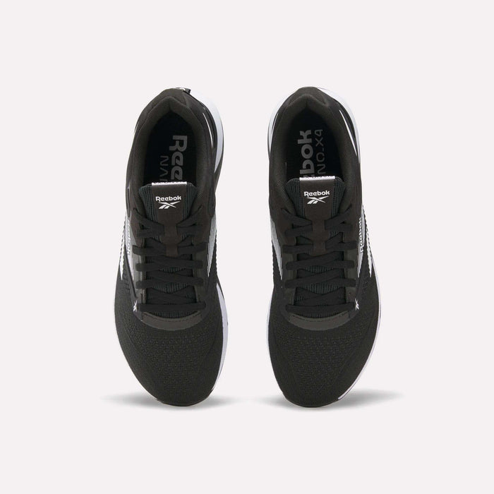 Top view of a pair of black Reebok Nano X4 Training Shoes with white soles and visible Reebok logos on the tongue and inner sole, displayed side by side on a white background.