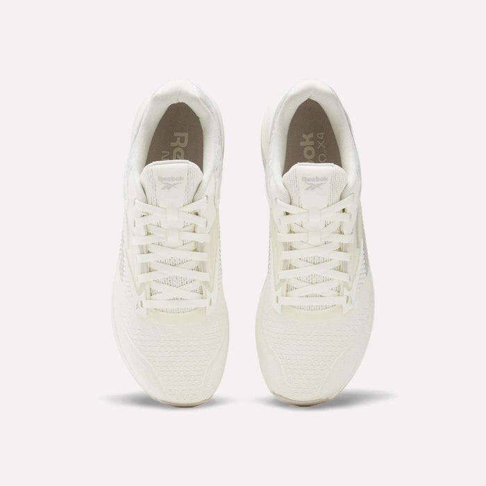 Top view of a pair of white Reebok Nano X4 Training Shoes with laces, placed side by side on a light, neutral background.
