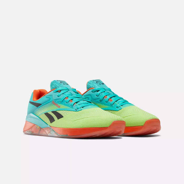Reebok Nano X4 Training Shoes are lightweight athletic sneakers with a bright turquoise upper, neon yellow accents, black side stripes, orange lining, and translucent orange soles.