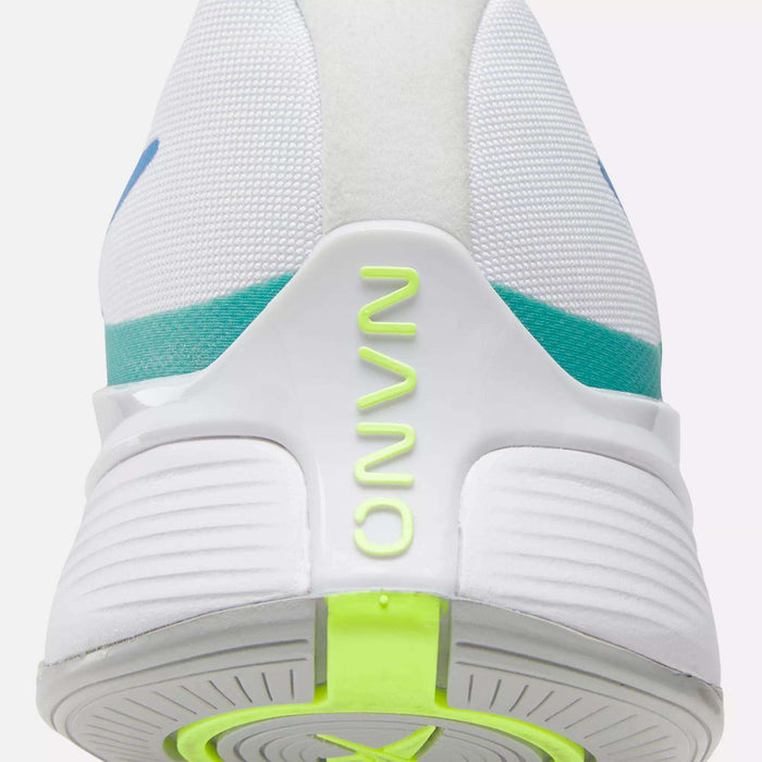 Close-up of the heel of the Reebok Nano X4 Training Shoes, a lightweight white trainer with "NANO" in neon yellow-green on the back, turquoise and blue accents, and a textured white sole featuring a neon green section.
