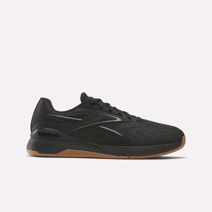 The Reebok Nano X5 Edge Training Shoes in black feature a low-profile, lace-up design with a Flexweave upper, subtle logo, and brown rubber sole—ideal for precision training. Shown against a plain white background.