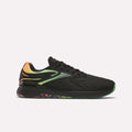 The Reebok Nano X5 Edge Training Shoes feature a black Flexweave upper with green and orange gradient accents on the heel and upper, plus a multicolored green-orange patterned sole, displayed against a plain white background.