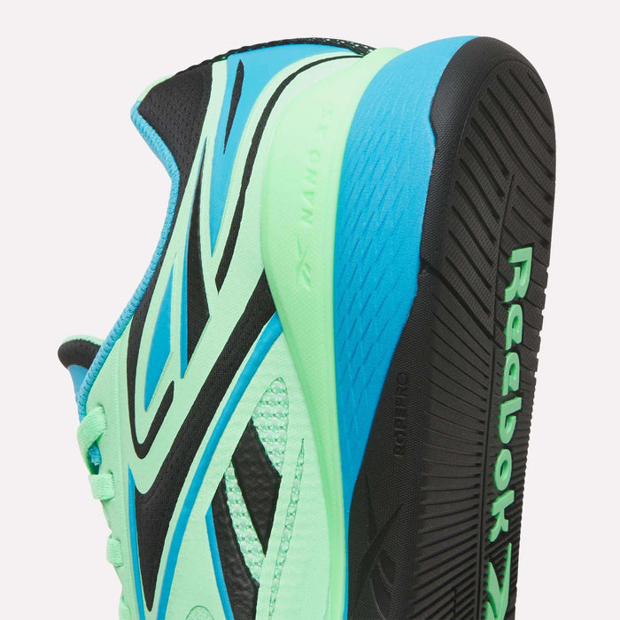Close-up of the Reebok Nano X5 Edge Training Shoes in turquoise, green, and black, highlighting Flexweave sides, detailed tread pattern on the sole, and "Reebok" branding.