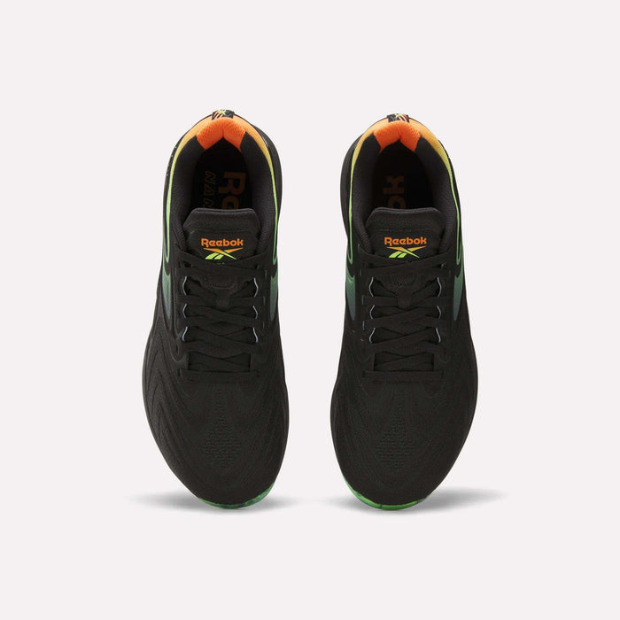 A top view of the Reebok Nano X5 Edge Training Shoes in black, featuring gradient green and orange heel accents, Flexweave support material, and vibrant Reebok logos on the tongue.