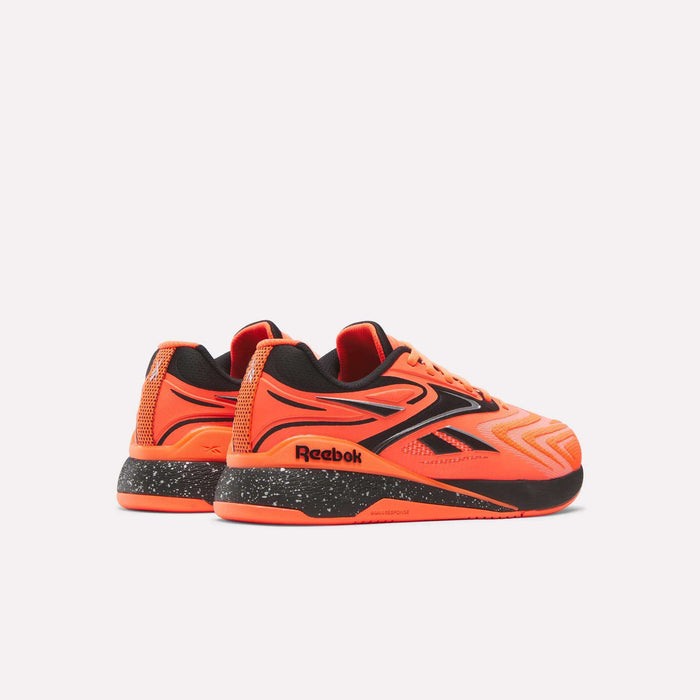 A pair of Reebok Nano X5 Edge Training Shoes in bright orange with black and red accents, featuring a chunky speckled black and white sole, designed for peak performance, displayed against a plain light background.