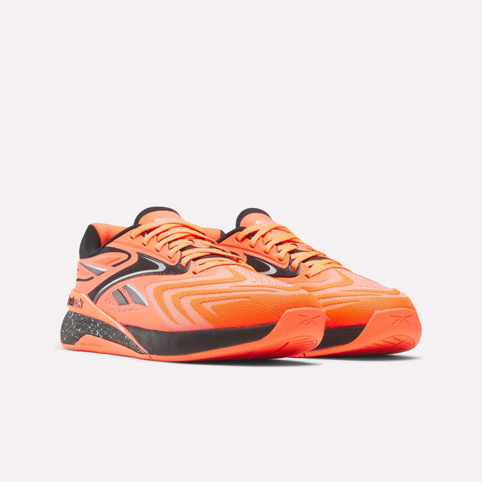 Reebok Nano X5 Edge Training Shoes in bright orange with black accents and a patterned midsole feature a low-top design, shown on a light background, built for peak performance.
