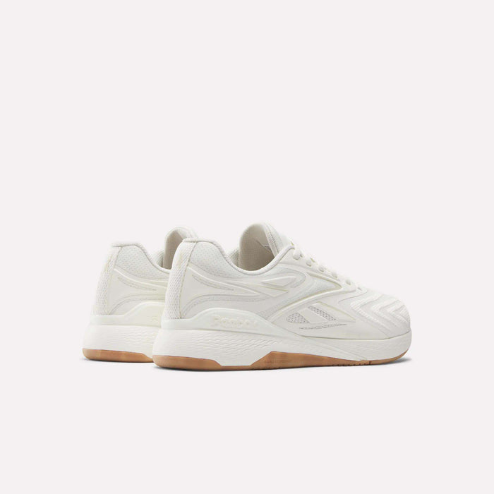 The Reebok Nano X5 Edge Training Shoes in white feature textured details and gum soles, shown on a plain white background from a side and back angle to highlight both their style and performance.