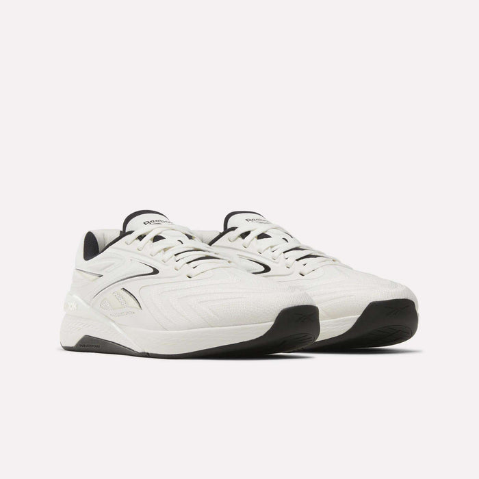 A pair of Reebok Nano X5 Edge Training Shoes in white, featuring black soles and subtle stitched patterns crafted from Flexweave material, designed for precision training, displayed on a plain light background.