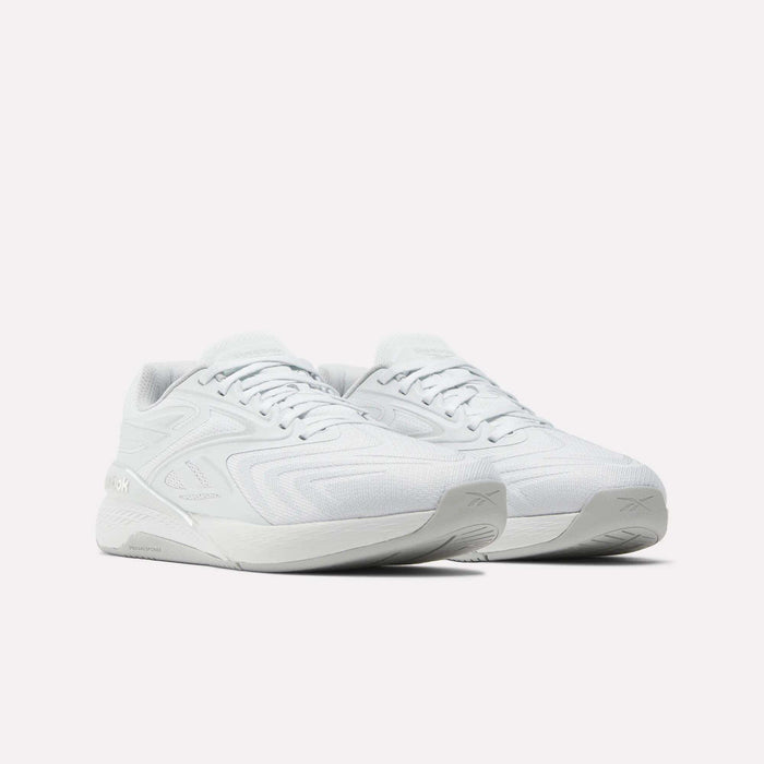 A pair of Reebok Nano X5 Edge Training Shoes in white, featuring Flexweave texture, thick soles, and subtle branding on the heel and side, displayed against a plain white background.