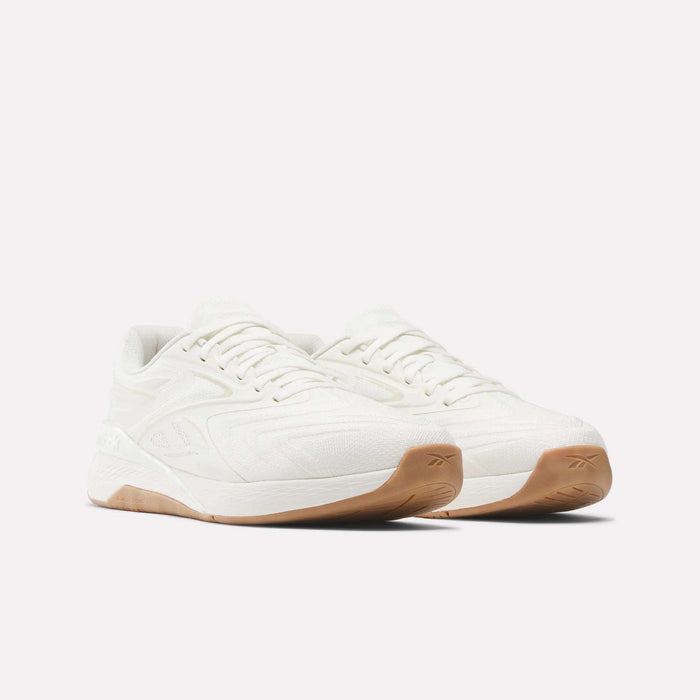 Reebok Nano X5 Edge Training Shoes in white feature textured uppers and light brown rubber soles, placed side by side on a white background—delivering performance and style for your workouts.
