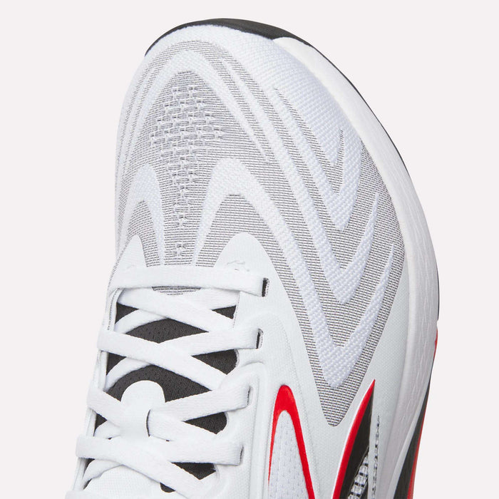 Close-up of the upper section of Reebok Nano X5 Edge Training Shoes, showing Flexweave fabric, gray and red accents, white laces, a black tongue, wavy gray patterns, and textured detail.