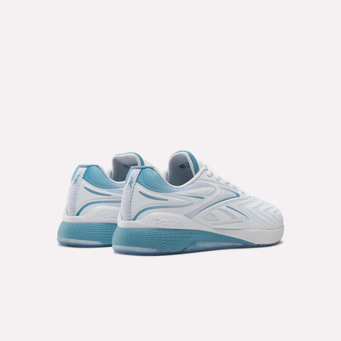A pair of Reebok Nano X5 Edge Training Shoes in white with light blue and teal accents, made with Flexweave material, are shown from the back and side on a plain white background.