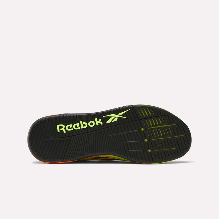 The image displays the sole of Reebok Nano X5 Edge Training Shoes featuring a black base with yellow-green accents, a bold yellow-green Reebok logo, and a durable tread pattern with Flexweave for enhanced grip.