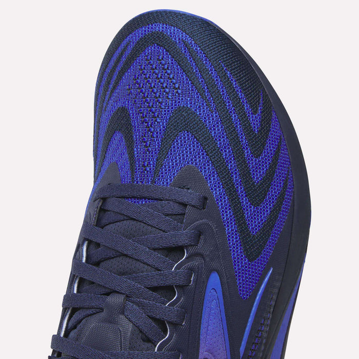 Close-up of the front and side of Reebok Nano X5 Edge Training Shoes showcasing a blue and black woven upper with black laces and a textured design—perfect for precision workouts.