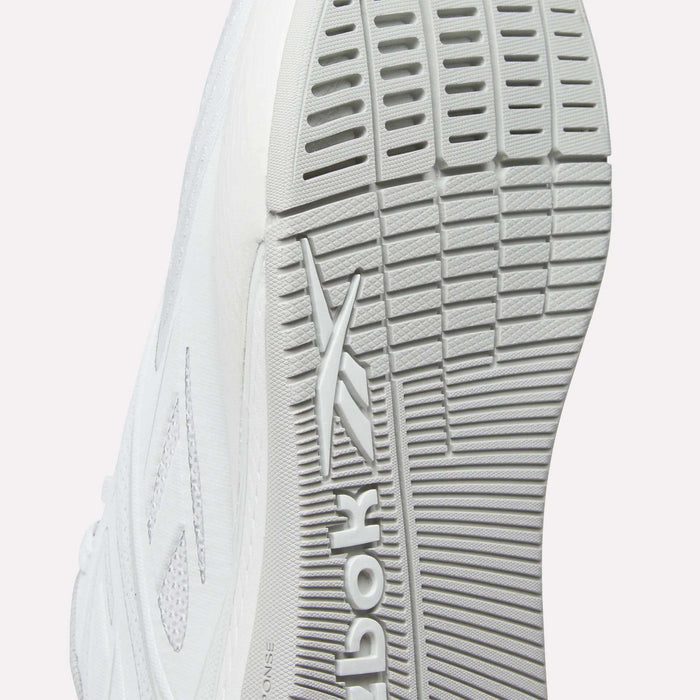 Close-up of the sole on Reebok Nano X5 Edge Training Shoes, featuring a textured tread pattern and Flexweave upper, with the Reebok logo embossed on the bottom.