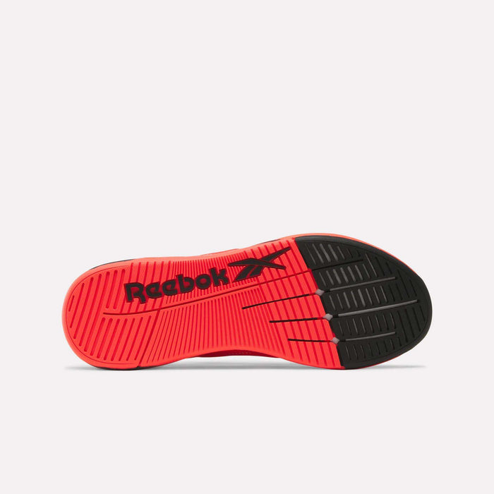 The image displays the sole of the Reebok Nano X5 Edge Training Shoes in red and black, highlighting the Reebok logo and multiple traction patterns designed to enhance grip—perfect for performance and training activities.