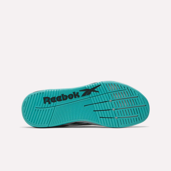 The image shows the teal sole of Reebok Nano X5 Edge Training Shoes with black Reebok logo and vector, featuring horizontal and diagonal grooves for traction on a plain white background.