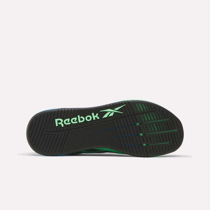 The image shows the black rubber sole of the Reebok Nano X5 Edge Training Shoes, displaying green Reebok branding, textured tread patterns, Flexweave material, and green accents.