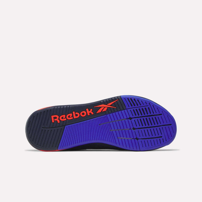 Sole of a Reebok Nano X5 Edge Training Shoe showing black and blue rubber tread with orange Reebok logo on the midfoot, displayed on a plain white background for a performance-ready appearance.