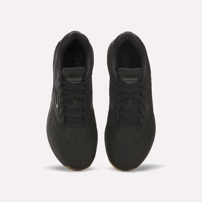 Top view of Reebok Nano X5 Edge Training Shoes in black, featuring Flexweave uppers, laces, a tongue with Reebok branding, and a textured pattern designed for superior support and performance.