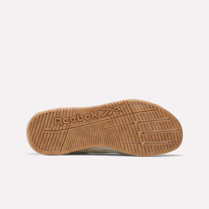 The image displays the sole of Reebok Nano X5 Edge Training Shoes, made of light brown rubber with textured patterns for grip. The Reebok logo is embossed on the sole’s left side.