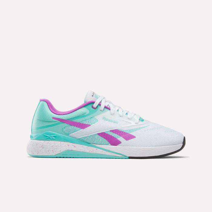The Reebok Nano X5 Training Shoes are white men's sneakers with teal and purple accents, including a teal logo, heel, outsole, and purple heel tab and lining. Shown with white laces on a plain white background.