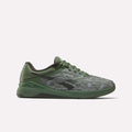 The Reebok Nano X5 Training Shoes, shown in side profile on a white background, feature a green camouflage pattern with black accents, combining iconic men's shoe style with the comfort and performance of athletic sneakers.