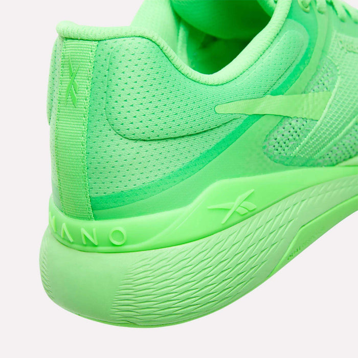 Close-up of the heel and side of Reebok Nano X5 Training Shoes in bright green, highlighting the textured sole, perforated upper, and stylized X logo near the heel—designed for a comfortable fit.