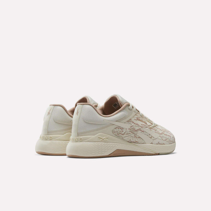 A pair of beige and cream Reebok Nano X5 Training Shoes for men with textured side details, designed for comfortable training, shown from the back and side on a plain white background.