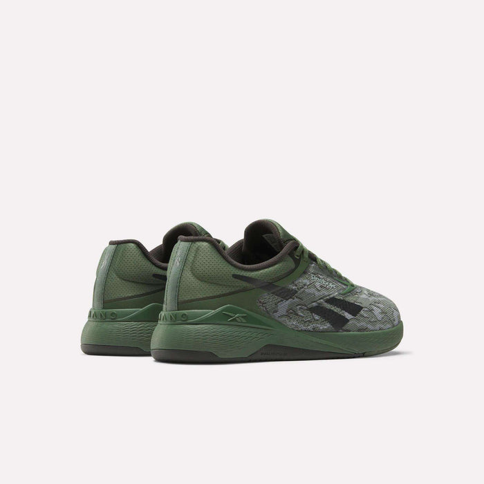 A pair of Reebok Nano X5 Training Shoes in green with black accents and textured patterns, displayed from the back and side on a plain white background.