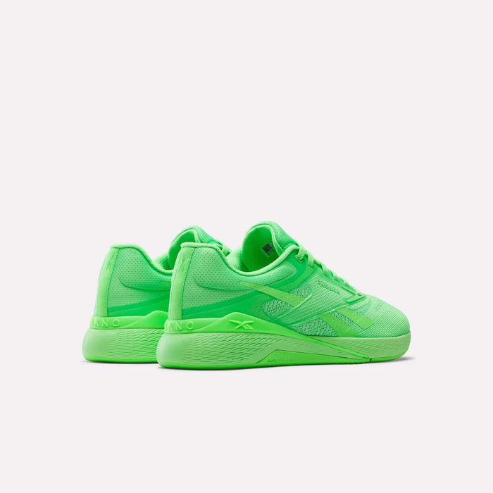 The Reebok Nano X5 Training Shoes feature bright neon green mesh uppers, secure laces, and textured soles for comfort, shown on a plain white background.