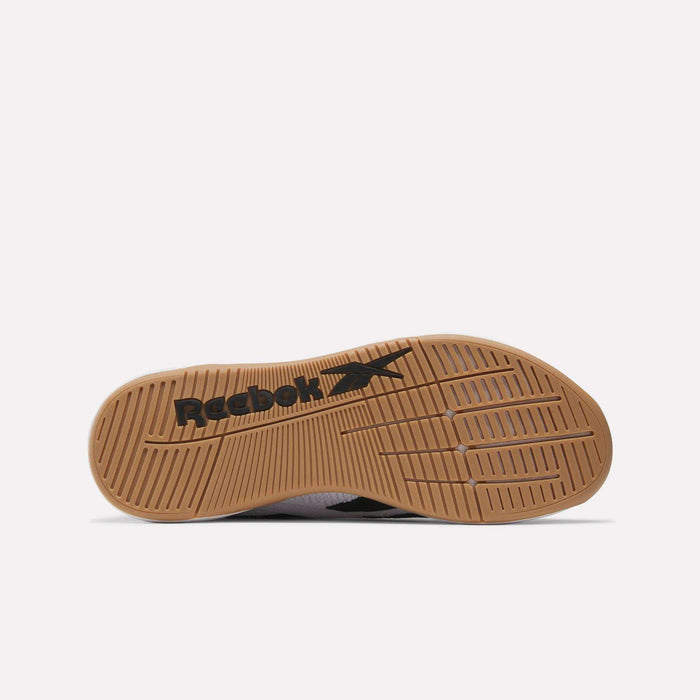 The image shows the bottom view of Reebok Nano X5 Training Shoes with a brown rubber sole, black Reebok logo, and textured grip patterns.