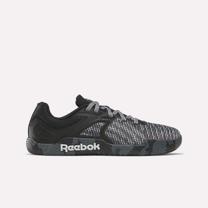 The Reebok Nano Zero Training Shoes feature a black and gray textured upper, patterned laces, and a black sole with a white logo—shown in side profile and ideal for strength training—against a plain white background.