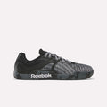 The Reebok Nano Zero Training Shoes feature a black and gray textured upper, patterned laces, and a black sole with a white logo—shown in side profile and ideal for strength training—against a plain white background.