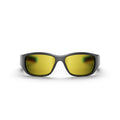 Front view of Reebok Nitrous Smart Audio Sunglasses in black, featuring wide yellow-tinted polarized lenses, shown against a plain white background.