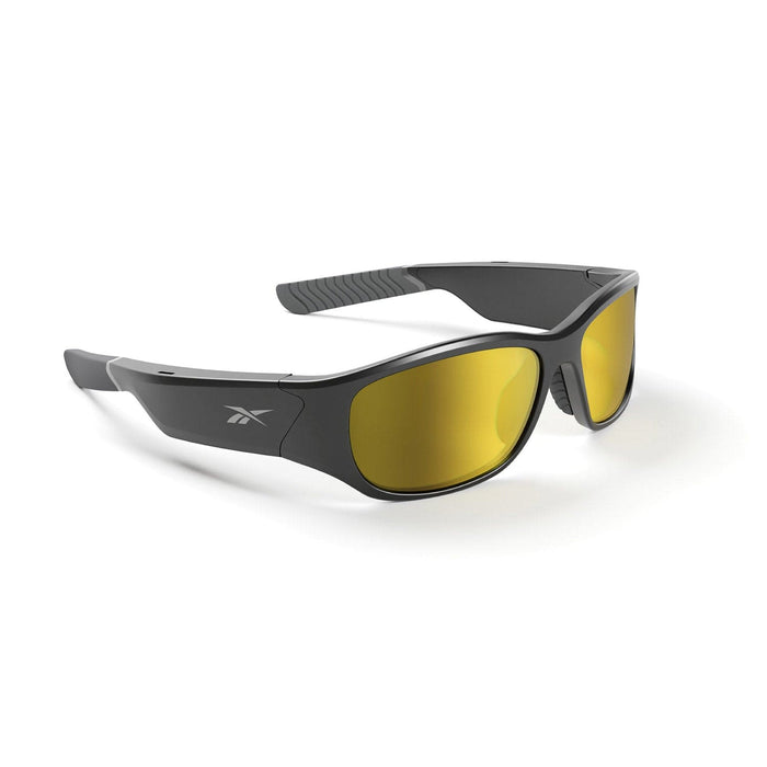 Reebok Nitrous Smart Audio Sunglasses shown on a white background, featuring black wraparound frames, yellow-tinted polarized lenses, and a small side logo.