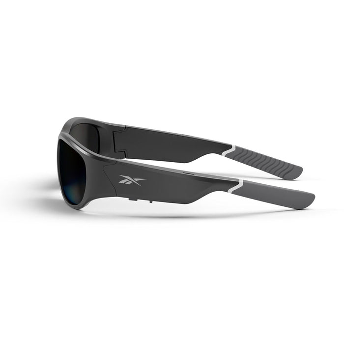 Reebok Nitrous Smart Audio Sunglasses in sleek black feature thick arms, gray rubberized tips, polarized lenses, and a small side logo, displayed against a white background.