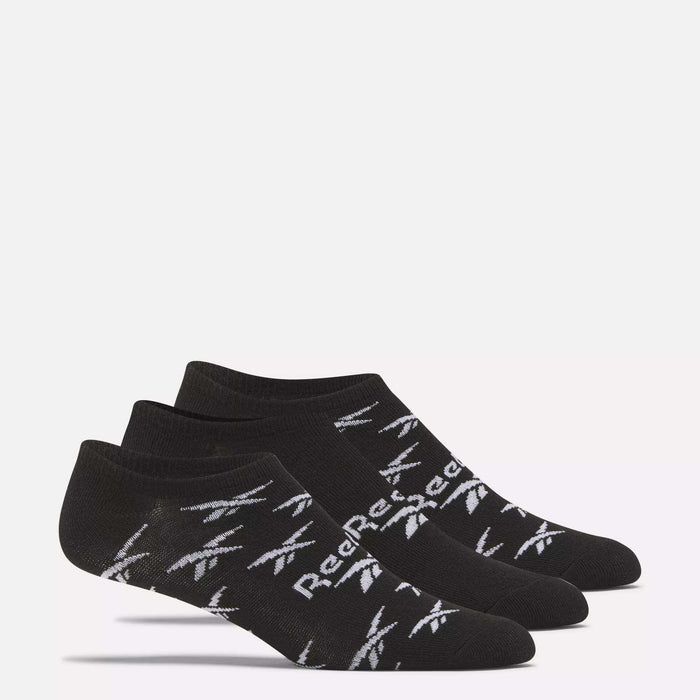 Three pairs of Reebok No-Show Liner Socks, featuring black fabric with white logos and text and moisture-wicking properties, are shown side by side on a white background.