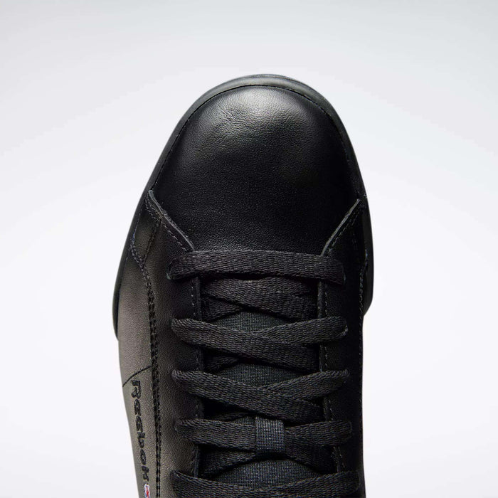 Top view of the Reebok Men's NPC II Shoes in black leather with black laces, featuring the toe cap, tongue, and side logo—a stylish men's sneaker inspired by retro court design.