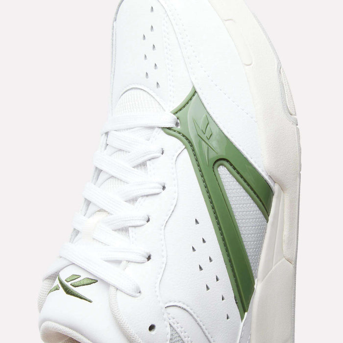Close-up of the Reebok Omni Edge Shoes, a white sneaker with green accents. The design features a leather upper, white laces, perforated details, and a green Reebok logo on the side. The shoe is angled to highlight both the side and top, evoking the classic aesthetic of retro basketball footwear.