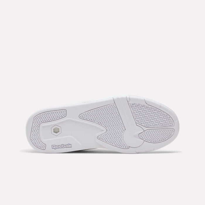 The bottom sole of the Reebok Omni Edge Shoes features textured grip patterns and displays the Reebok logo near the heel. Set against a light, minimalist background, this design highlights the classic retro basketball style and showcases a durable leather upper construction.