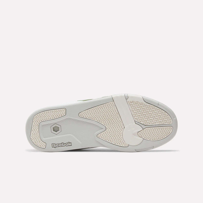 The image displays the sole of a Reebok Omni Edge Shoe in light gray, featuring textured grip patterns and the Reebok logo near the heel, highlighting the classic, retro basketball style of these sneakers.