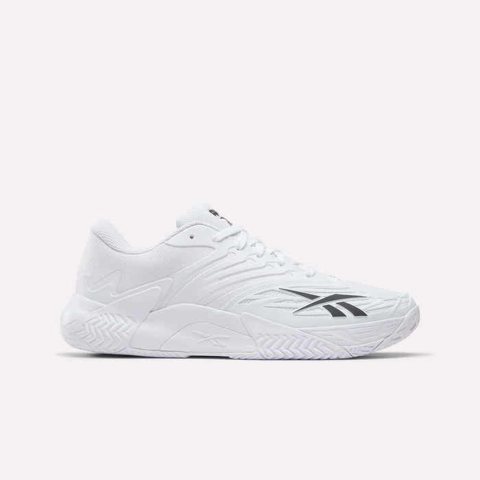 The Reebok Phase EVO Tennis Shoes feature a white mesh upper, textured sole, and black Reebok logo on the side—durable athletic sneakers ideal for tennis. Shown against a light plain background.