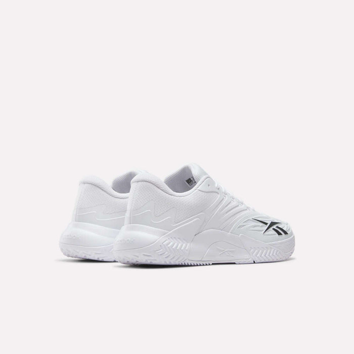 A pair of Reebok Phase EVO Tennis Shoes in white with textured soles and black side accents, shown on a plain white background. Both the outer and rear views of the sneakers are visible in the image.