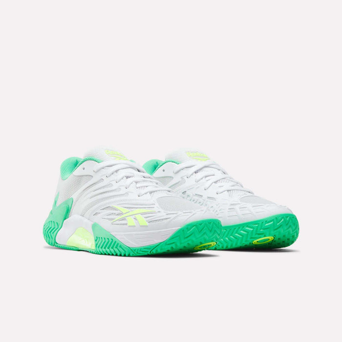 The Reebok Phase EVO Tennis Shoes feature a white design with neon green accents on the soles, laces, and lining, shown against a plain white background—ideal performance sneakers for tennis.