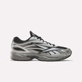 The Reebok Premier Road 1000 Shoes in Black/Silver/Grey4 are athletic sneakers inspired by Y2K designs, featuring black laces and a thick, cushioned sole, shown on a plain white background.
