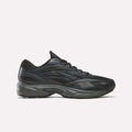 The Reebok Premier Road 1000 Shoes in Almostblack/Black are athletic sneakers inspired by retro running styles, featuring a chunky dark sole, a mesh upper, and sleek wavy design lines, shown in profile against a plain light background.