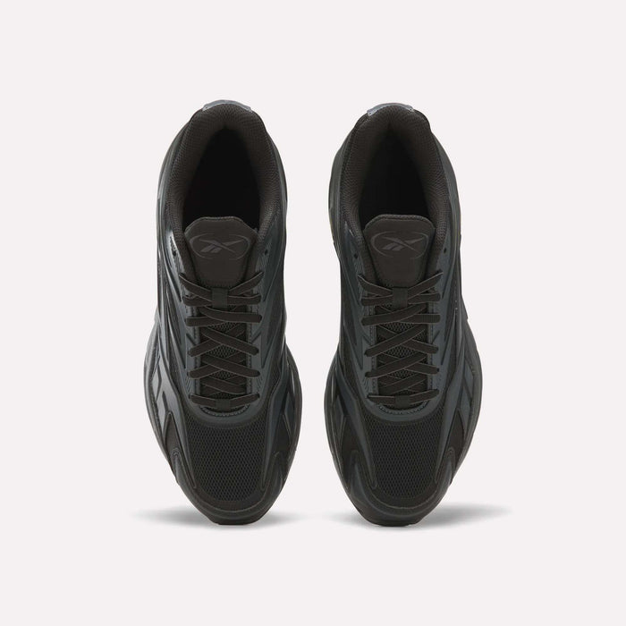 A pair of black Reebok Premier Road 1000 Shoes viewed from above on a plain white background, showcasing their mesh and synthetic construction with the Reebok logo visible on each tongue—a classic nod to Y2K style with a timeless athletic silhouette.